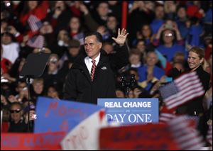 Mitt Romney acknowledges the crowd in West Chester, Ohio. An estimated 30,000 people turned out Friday in the home county of House Speaker John Boehner.