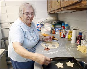 Sister Gretchen Faerber makes sugar cookies in Regina Hall in the Sylvania Franciscan Village.  The coordinator of the 18th annual Christmas bake and craft sale that bears her name has been busy preparing for the event, which will be held on Friday and Saturday.