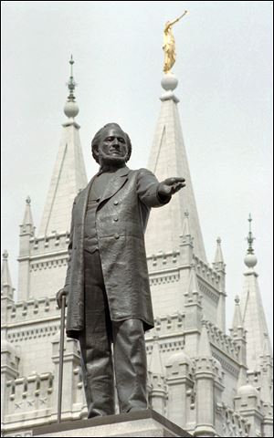 Mitt Romney can trace ancestors back to associates of Brigham Young,  subject of a statue at the temple in Salt Lake City.