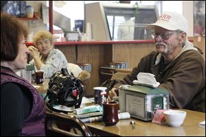 Deborah Core of Lima, left, and Lester Wood, eat a late breakfast at the Lickity Split in Lima. Mr. Wood says he might be one of the few undecided voters left in Ohio. He says the availability of jobs is what concerns him most.