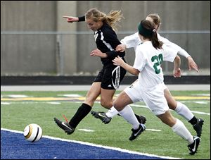 Slug: SPT pburg4p  THE BLADE/JEREMY WADSWORTH  Caption: Perrysburg's Allex Brown (18) scores  against  Medina  during the Division II regional soccer final Saturday, 11/03/12, in in Sandusky, Ohio. Perrysburg won 2-0.