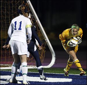 Slug: SPT regionalsoccer01p  THE BLADE/JEREMY WADSWORTH  Caption: St. Ursula goalie Sydney Yeager (1) makes a stop against Akron Archbishop Hoban during a Division II girls regional soccer semifinal Wednesday, 10/31/12, at Cedar Point Stadium in Sandusky, Ohio. St. Ursula won 1-0.