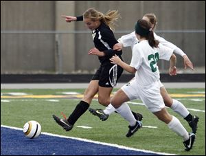 Perrysburg's Allex Brown (18) scores  against  Medina  during the Division II regional soccer final, 11/03/12, in in Sandusky. Perrysburg won 2-0.