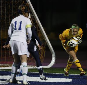 St. Ursula goalie Sydney Yeager (1) makes a stop against Akron Archbishop Hoban during a Division II girls regional soccer semifinal, 10/31/12, at Cedar Point Stadium in Sandusky. St. Ursula won 1-0.
