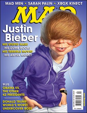 In this magazine cover image released by DC Comics, Alfred E. Neuman , the fictional cover boy of 