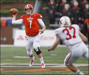 Bowling Green quarterback Matt Schilz fires a pass as Miami linebacker Pat Hinkel, 37, moves in during the third quarter of their  football game at Doyt Perry Stadium in Bowling Green, Saturday, October 13, 2012.