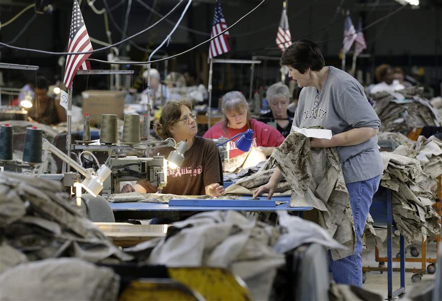Apparel-workers-sew-military-uniforms-at-American-Power-Source