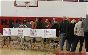 A line of voters forms at McCord Junior High School in Sylvania.