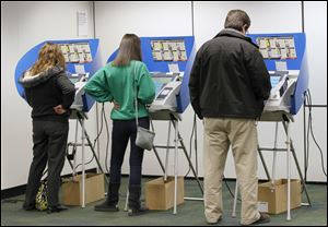 Voters cast their ballots at the Way Library in Perrysburg.