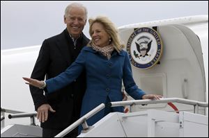Vice President Joe Biden, accompanied by his wife Jill Biden, board Air Force Two at a Delaware Air National Guard Base in New Castle , Del.
