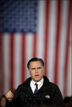 Mitt Romney speaks to 10,000 cheering supporters at Port Columbus International Airport on Monday night.