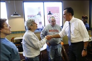 Republican presidential candidate, former Mass. Gov. Mitt Romney greets customers as he make an unscheduled stop at a Wendy's restaurant in Richmond Heights, Ohio, on Election Day.