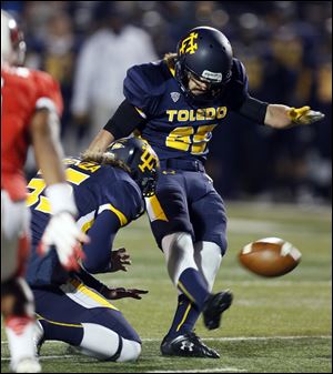 University of Toledo kicker Jeremiah Detmer kicks a field goal.