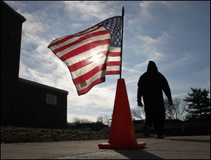 A voter leaves the Sylvania district's McCord Junior High School after casting his ballot.