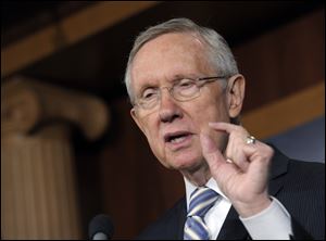 Senate Majority Leader Harry Reid of Nev. gestures as he discusses Tuesday's election results during a news conference on Capitol Hill in Washington.
