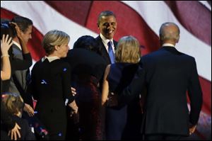 President Barack Obama celebrates after his speech at his election night party Wednesday, Nov. 7, 2012, in Chicago. President Obama defeated Republican challenger former Massachusetts Gov. Mitt Romney.
