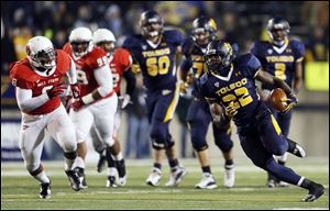 Toledo running back David Fluellen (22) rushed the ball 34 times for 200 yards. It was his third 200-yard game of the season.