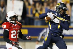 University of Toledo WR Bernard Reedy scores a touchdown early in the game Tuesday night at the Glass Bowl.