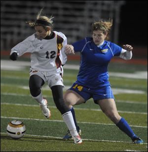 Becca Joseph of St Ursula Academy defends against Walsh Jesuit's Halle Stelbasky on Tuesday night at Perkins High School.