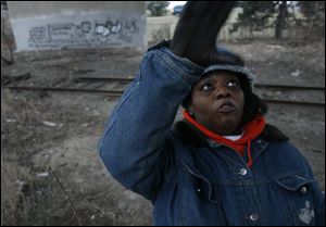 Bonita Brazzel Thomas of Teen Street Outreach seeks runaways at the Anthony Wayne Bridge.