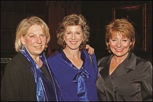 Kate MacPherson, left, Lisa Wolfe, center, and Patrice Spitzer, right, pose for a photograph Friday evening during the Sapphire Blues to Benefit the Toledo Opera at the Toledo Club in Toledo. This is the 50h anniversary of the Toledo Opera Guild. 
