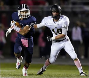 Charlie Harris leads Napoleon with 833 yards rushing. The Wildcats captured the NLL title.
