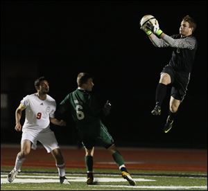 Ottawa Hills' goalie Michael Geiger blocks a shot.