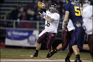 DIVfootball10p -- Kyle Edwards, of the Genoa Comets,passes the ball during the second quarter of their game against the Ottawa-Glandorf Titans at JC Donnell Memorial stadium in Findlay, Ohio on Friday, Nov. 9, 2012.  THE BLADE/ZACK CONKLE