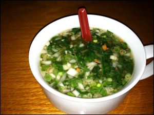 Miso vegetable soup (includes mushroom, spinach, green onion, and carrot).