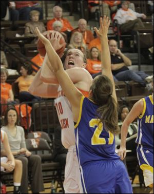 BGSU's Allison Papenfuss looks to shoot over Madonna's Michelle Lindsey. Papenfuss had a career-high 13 points win the Falcons' victory.