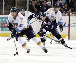 SPT walleye12p Walleye Todd Griffith is chased by the Stingrays' Tyler Johnson in the first period. The Toledo Walleye host the South Carolina Stingrays in Toledo, Ohio on November 11, 2012 The Blade/Jetta Fraser