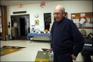 Glen LeFever of Toledo calls out square dancing directions at the Bedford Senior Center in Temperance, Mich. 