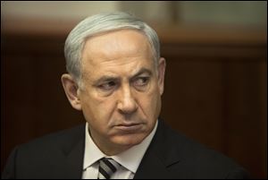 Israeli Prime Minister Benjamin Netanyahu attends the weekly cabinet meeting in his Jerusalem office, Sunday, Nov. 11, 2012. Netanyahu says his country is ready to strike harder against Gaza Strip militants if they don’t stop attacking Israel. (AP Photo/Sebastian Scheiner, Pool)