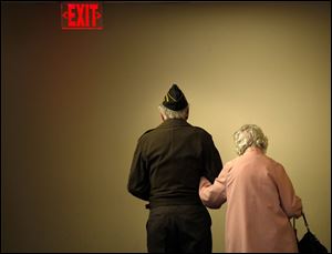 A couple makes their way to the exit after attending the eighth annual Veterans Appreciation Breakfast and Resource Fair in Savage Arena at the University of Toledo.