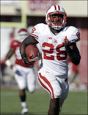 Wisconsin's Montee Ball runs 49 yards for a touchdown against Indiana on Saturday, when the Badgers piled up more than 500 rushing yards.