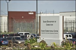 FILE - In this June 15, 2010 file photo, the Idaho Correctional Center is shown south of Boise, Idaho. A gang war that appears to have taken over parts of an Idaho private prison is spilling into the federal courts. A group of inmates at the Idaho Correctional Center is suing Corrections Corporation of America, contending the company is working with a few powerful prison gangs to control the facility and save money on staffing.(AP Photo/Charlie Litchfield, File)