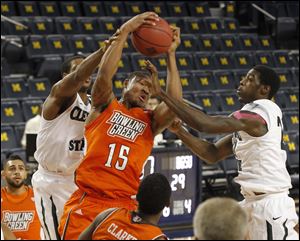 BGSU's A'uston Calhoun pulls down a defensive rebound from Cleveland State during NIT game at Crisler Arena at the University of Michigan in Ann Arbor, Mich. 