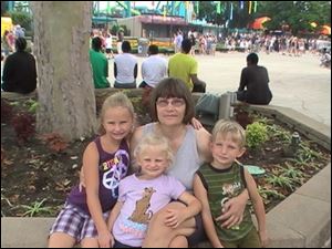 Grandmother Sandy Ford pictured with her three grandchildren Paige, Madalyn, and Logan who died Nov. 12 from carbon monoxide poisoning.