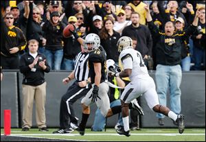 Iowa's Micah Hyde, left, scored on a fumble recovery for the Hawkeyes in a loss to Purdue.