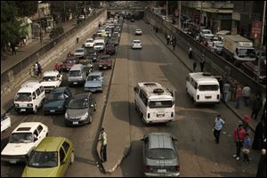 People wait in their cars in traffic in Cairo, Egypt, Wednesday. Metro workers in the Egyptian capital called off a strike Wednesday after five hours that brought Cairo’s already notoriously snarled traffic to a standstill.