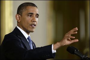 President Barack Obama answers a question during a news conference in the East Room of the White House in Washington, Wednesday, Nov. 14, 2012. (AP Photo/Charles Dharapak)
