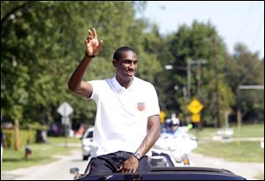 Erik Kynard Jr. will be joined by Toy Story characters, Buzz Lightyear, Woody, and Jessie as the parade’s co-grand marshals.