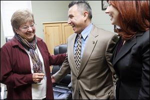 Employee Shirley Briggeman, left, shares a laugh with Ron and Cathy Tijerina. The Tijerinas are leasing the former Hope School in Henry County for the Ridge Project, which tries to help prison inmates and their families grow together and gain skills.