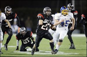 SPT mccombfb16p  McComb High School player Cody Wilson, 27, returns a kickoff to the Delphos St. John's 37 yard line during the second quarter at Donnell Stadium in Findlay, Friday, November 16, 2012.  The Blade/Andy Morrison