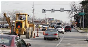 Lanes are reduced as gas line construction continues Thursday on Monroe Street, between Secor Road and Sylvania Avenue.