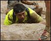  Teammate Dioni Gomez recovers from a 10,000 volt shock that sent him down into the mud.