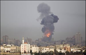 Explosion and smoke rise following an Israeli strike in Gaza, seen from the Israel Gaza Border, southern Israel, Saturday. 