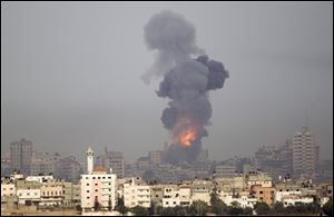 Explosion and smoke rise following an Israeli strike in Gaza, seen from the Israel Gaza Border, southern Israel, Saturday.