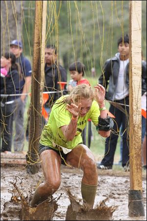 Ashley Sepanski runs through the Electroshock Therapy - a field of live wires.