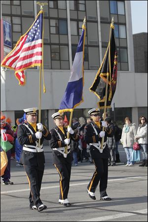  The Toledo Fire Department honor guard carries the colors.